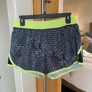 champion running shorts in grey and neon yellow